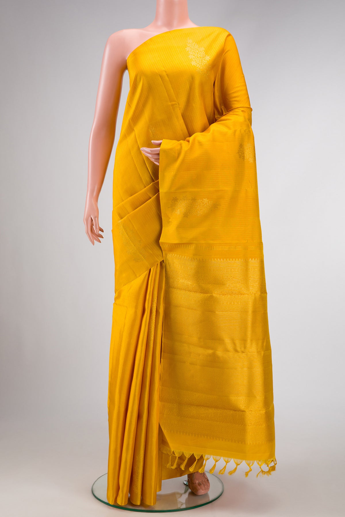 Yellow Dual Tone Kanjivaram Silk Saree with Stripes on the body and Without Border.  displayed on a mannequin