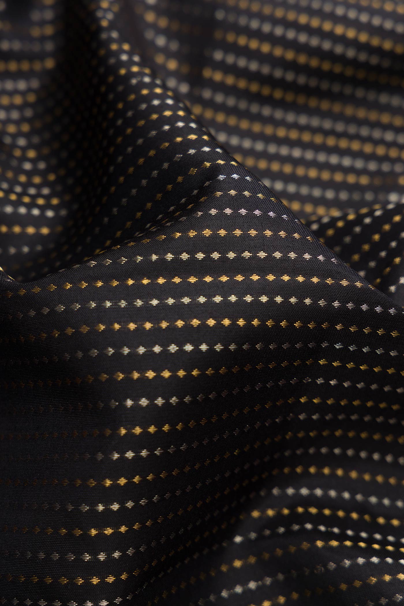 Close up of Black Dual Tone Soft Silk Saree with Stripes on the body and Zari Border.  displaying folds