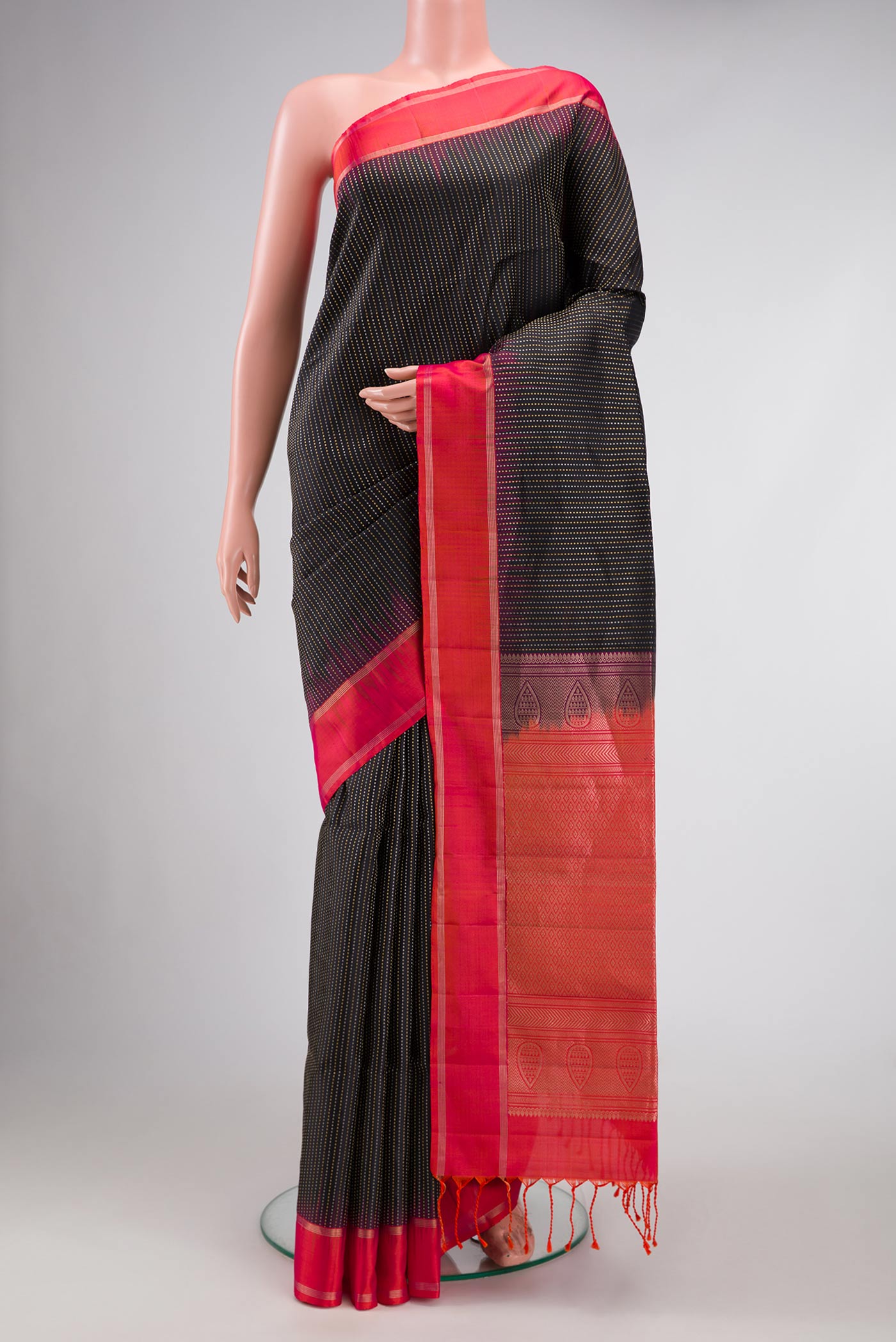Black Dual Tone Soft Silk Saree with Stripes on the body and Zari Border.  displayed on a mannequin