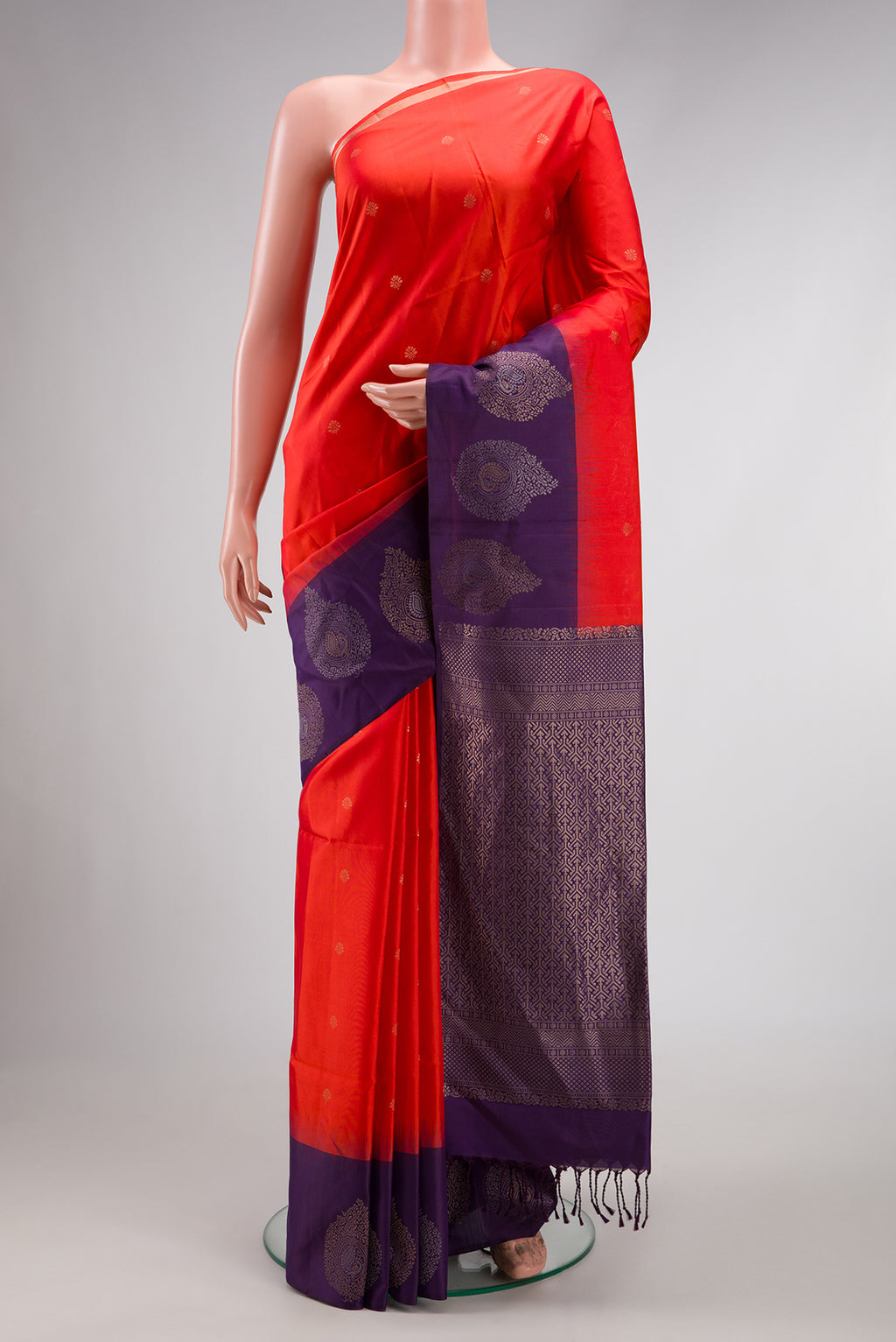 Red Dual Tone Soft Silk Saree with Zari Butta on the body and Zari Border.  displayed on a mannequin