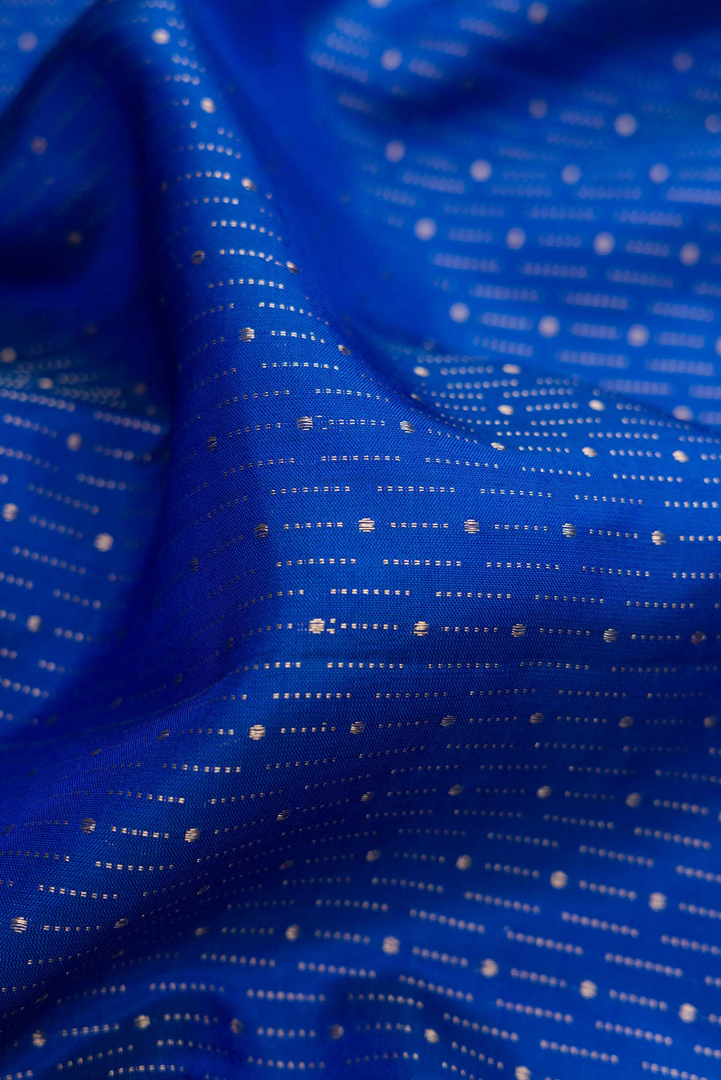 Close up of Royal Blue Dual Tone Soft Silk Saree with Zari Brocade on the body and Zari Border.  displaying folds