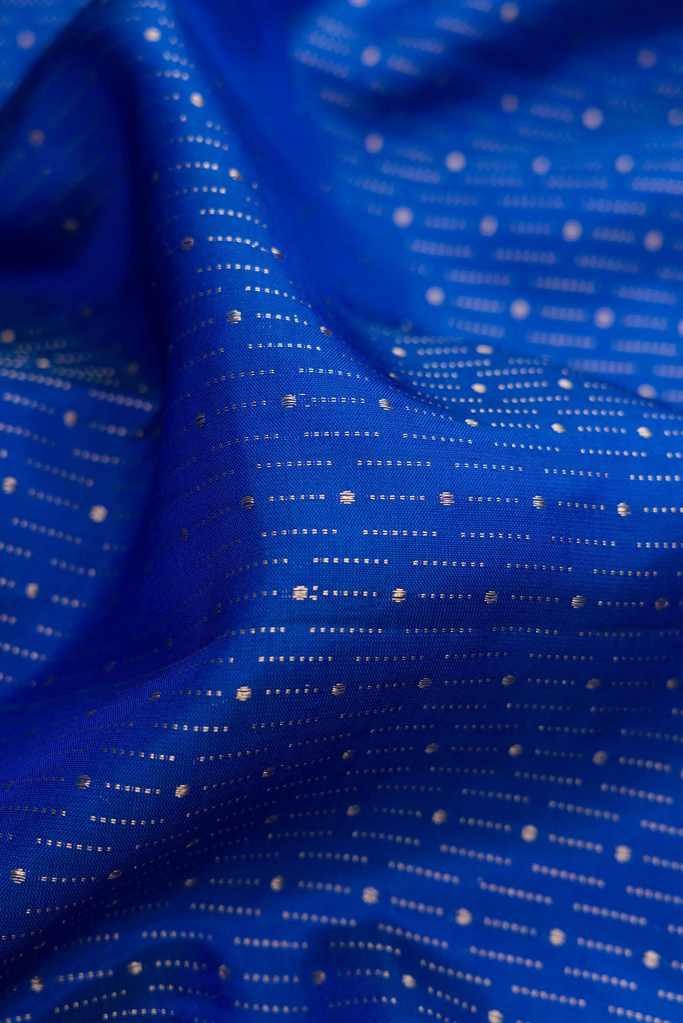 Close up of Royal Blue Dual Tone Soft Silk Saree with Zari Brocade on the body and Zari Border.  displaying folds