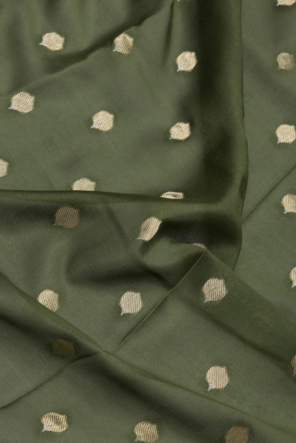 Close up of Mehandi Green Dual Tone Mysore Crepe Saree with Zari Butta on the body and Zari Border.  displaying folds