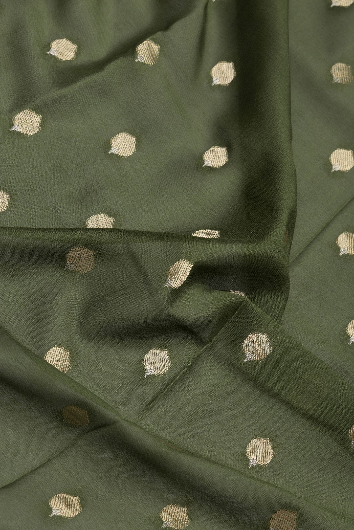 Close up of Mehandi Green Dual Tone Mysore Crepe Saree with Zari Butta on the body and Zari Border.  displaying folds