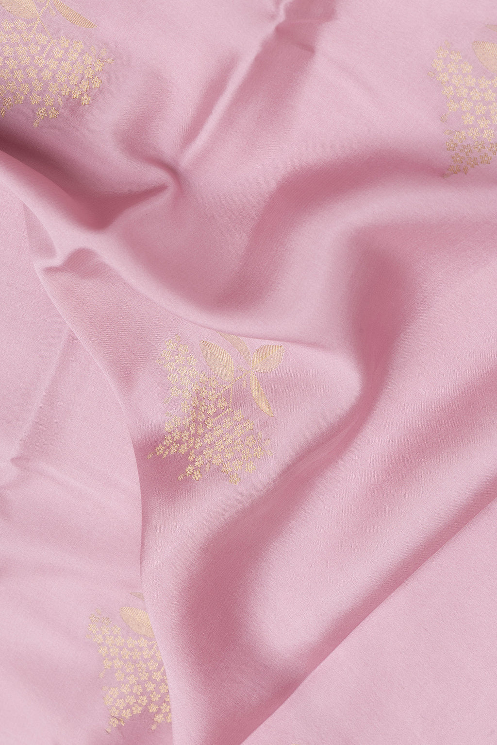 Close up of Pink Dual Tone Mysore Crepe Saree with Zari Butta on the body and Zari Border.  displaying folds
