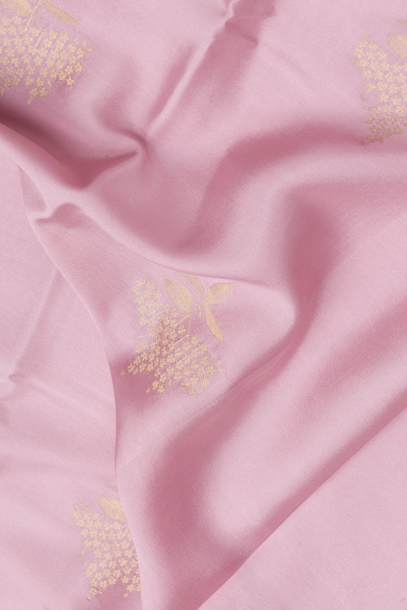 Close up of Pink Dual Tone Mysore Crepe Saree with Zari Butta on the body and Zari Border.  displaying folds