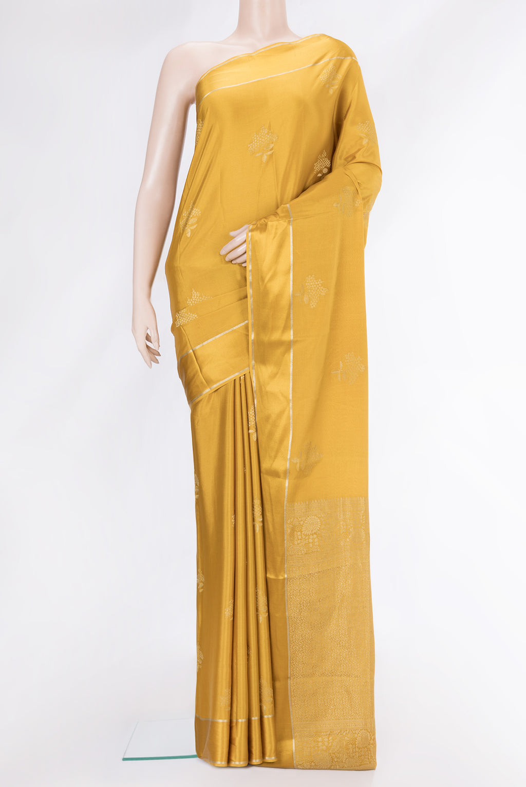 Mustard Dual Tone Mysore Crepe Saree with Zari Butta on the body and Zari Border.  displayed on a mannequin