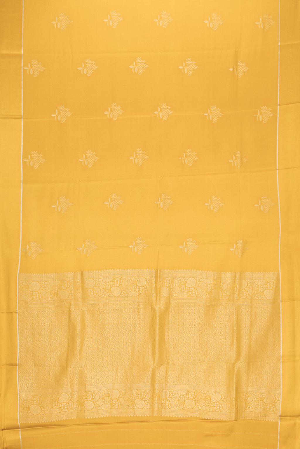 Flat view of Mustard Dual Tone Mysore Crepe Saree with Zari Butta on the body and Zari Border. 