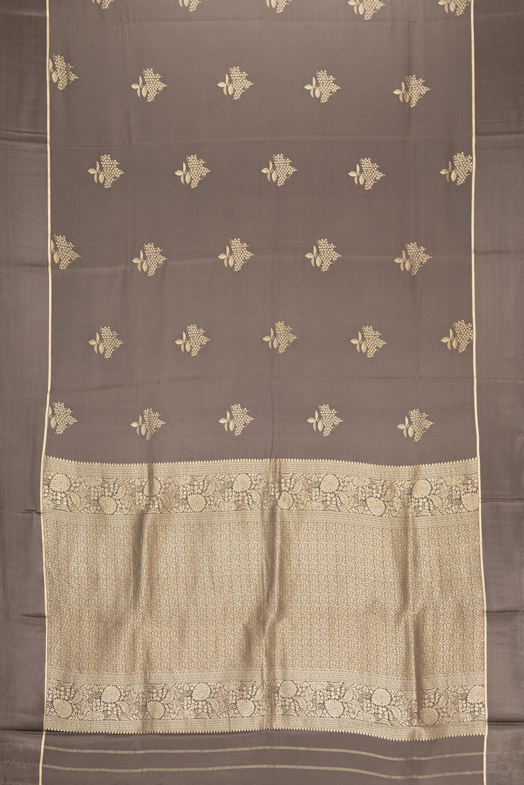 Flat view of Brown Dual Tone Mysore Crepe Saree with Zari Butta on the body and Zari Border. 