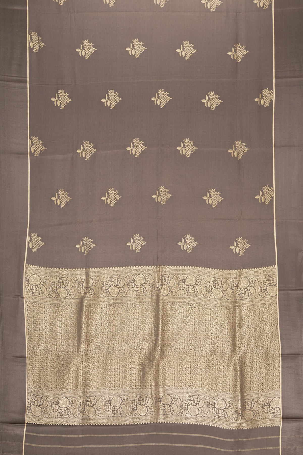 Flat view of Brown Dual Tone Mysore Crepe Saree with Zari Butta on the body and Zari Border. 