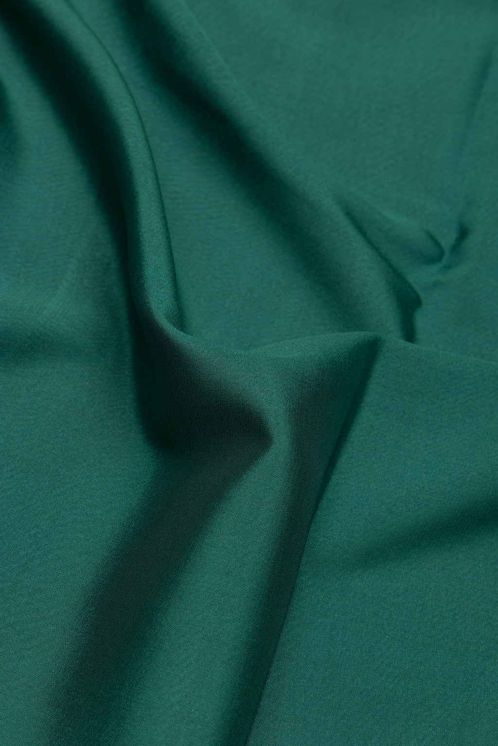 Close up of Bottle Green Dual Tone Mysore Silk Saree with Plain Body and Fancy Border.  displaying folds