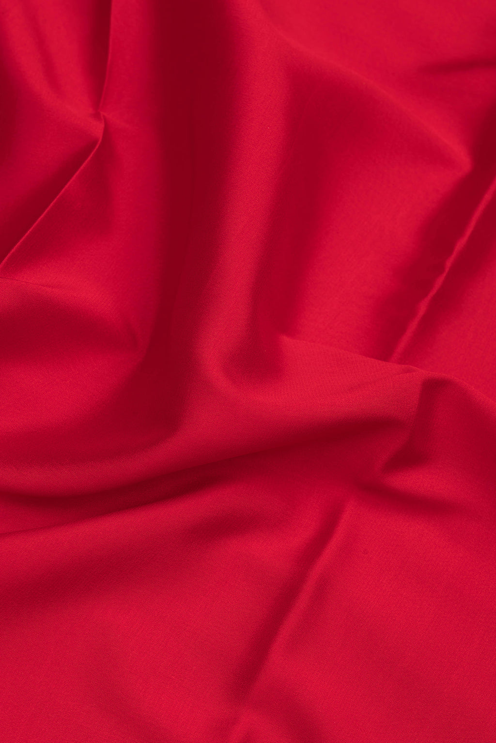 Close up of Red Mysore Silk Saree with Plain Body and Fancy Border.  displaying folds