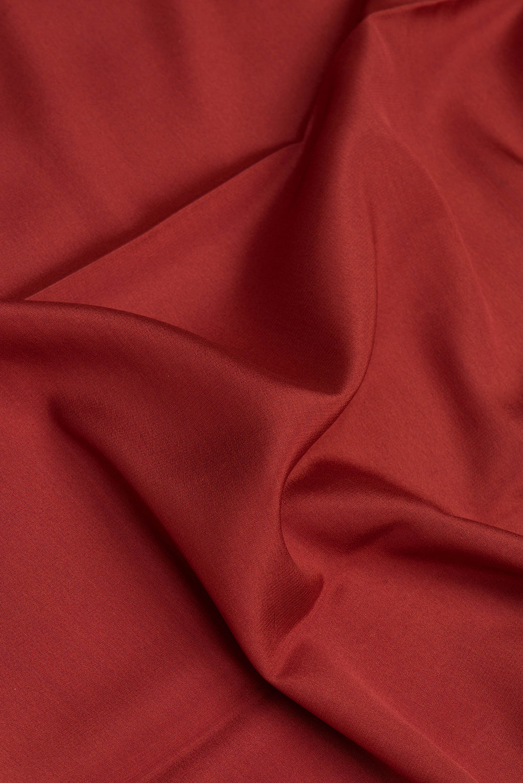Close up of Maroon Mysore Silk Saree with Plain Body and Zari Border.  displaying folds