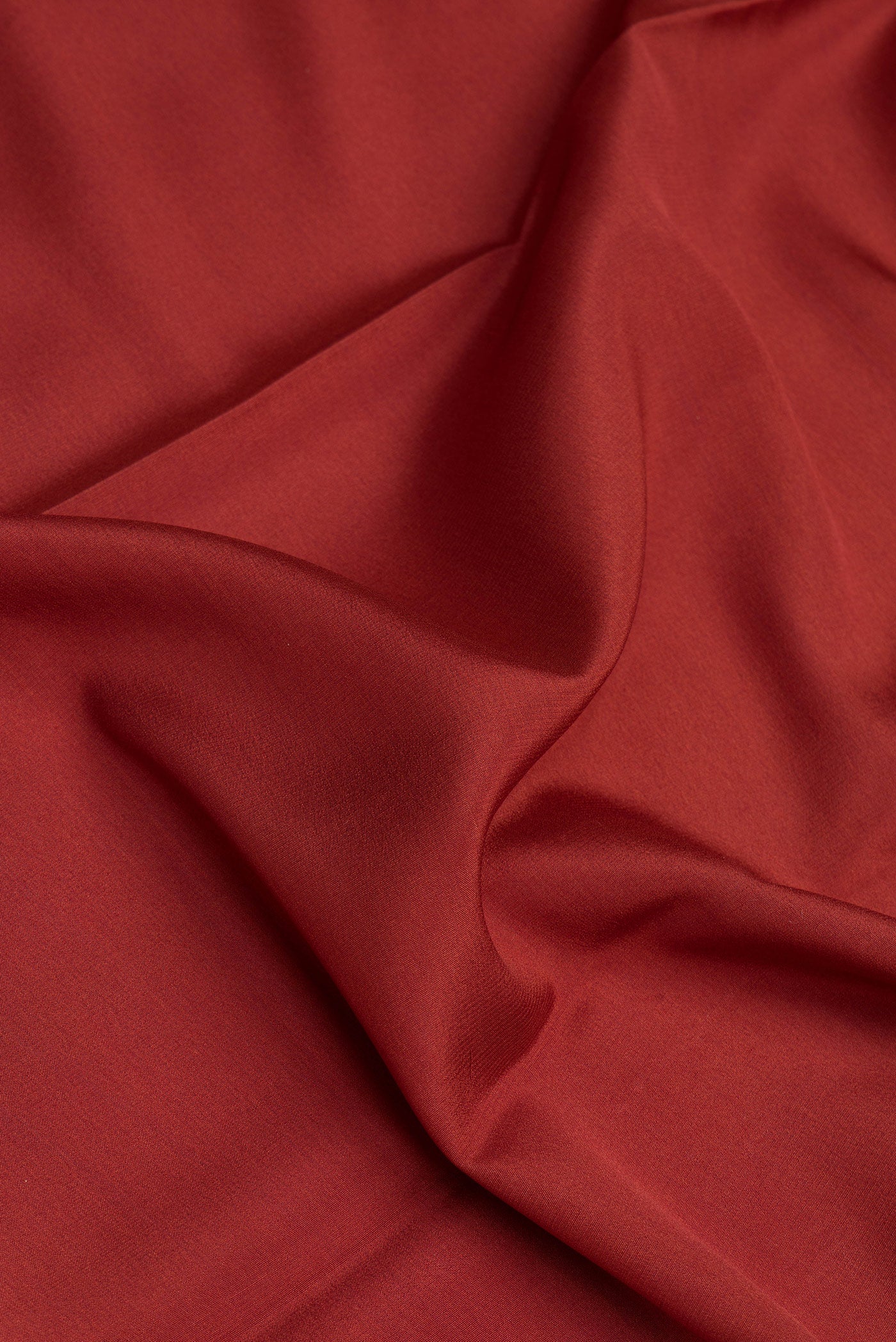 Close up of Maroon Mysore Silk Saree with Plain Body and Zari Border.  displaying folds