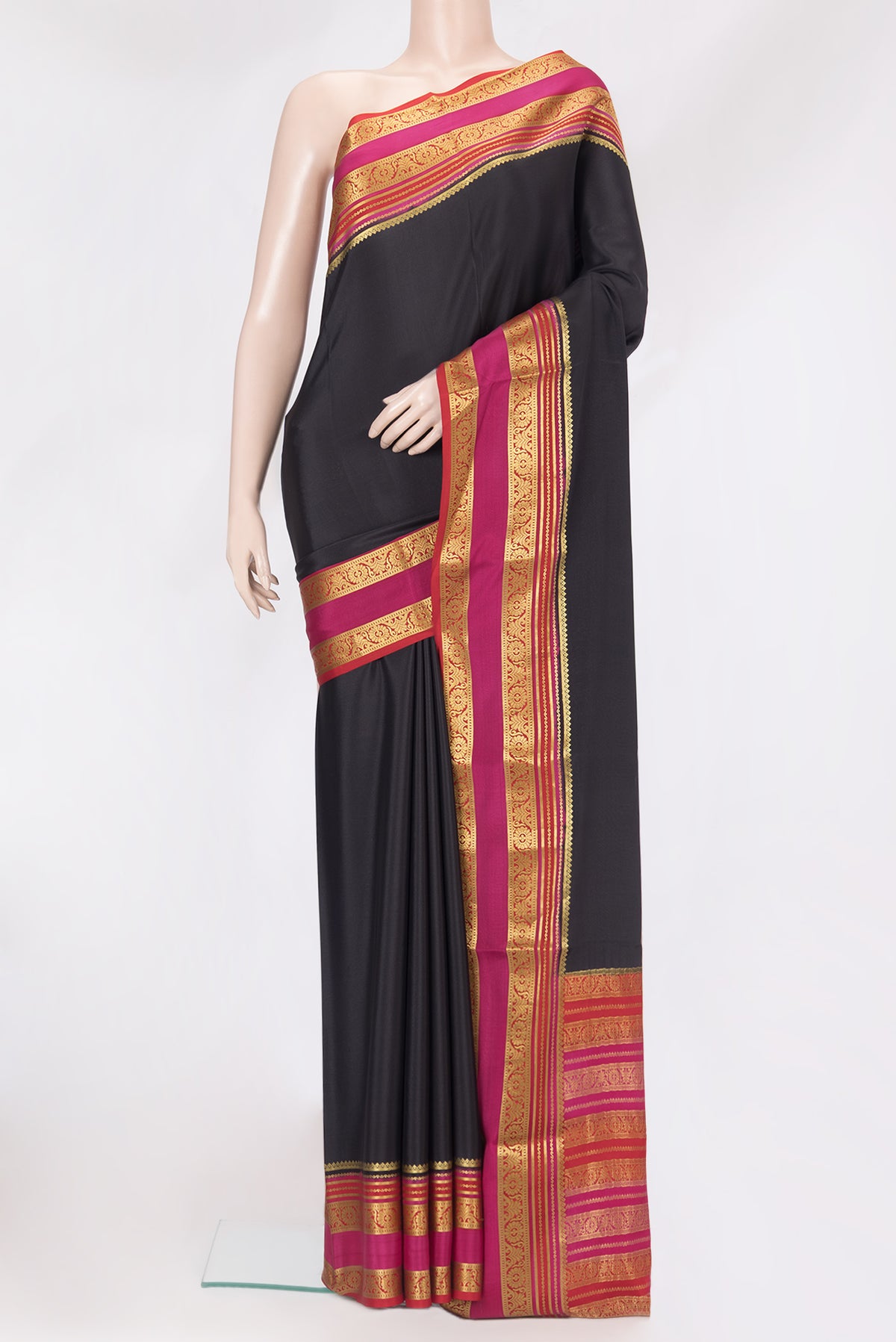 Black Mysore Silk Saree with Plain Body and Zari Border.  displayed on a mannequin