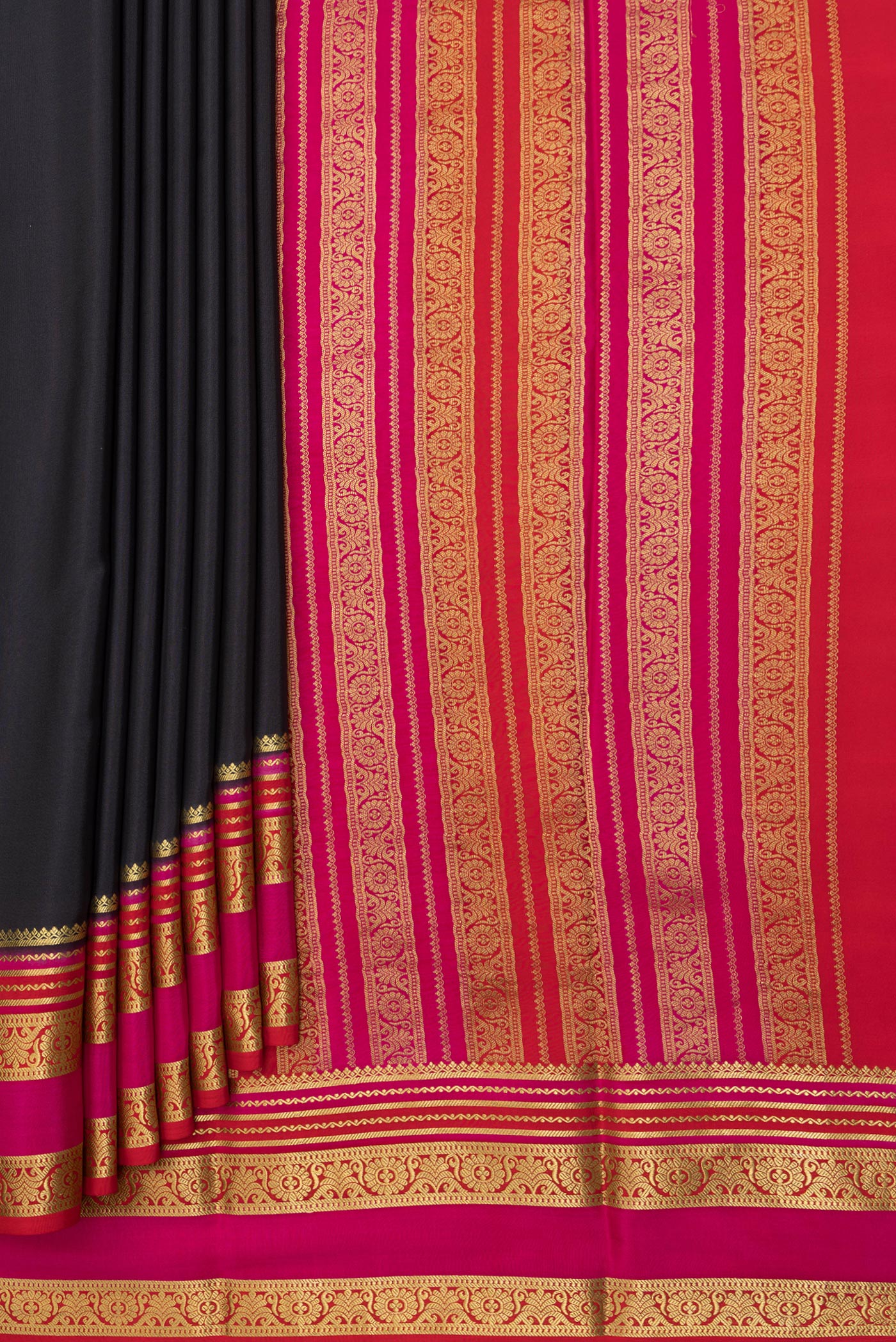 Pleats and pallu of Black Mysore Silk Saree with Plain Body and Zari Border. 