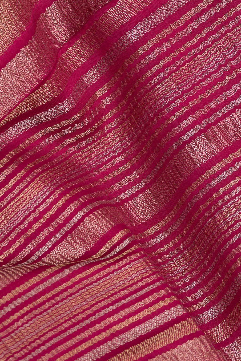 Close up of Dark Pink Banarasi Georgette Saree with Zari Brocade on the body and Without Border.  displaying folds