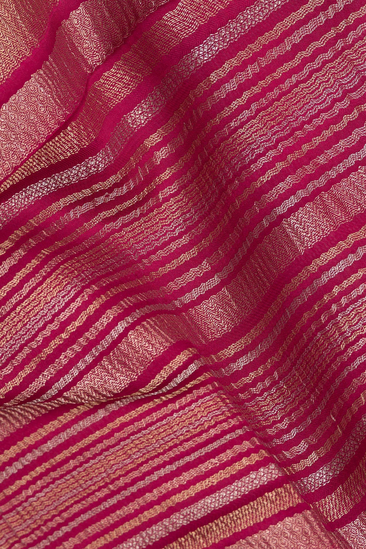 Close up of Dark Pink Banarasi Georgette Saree with Zari Brocade on the body and Without Border.  displaying folds