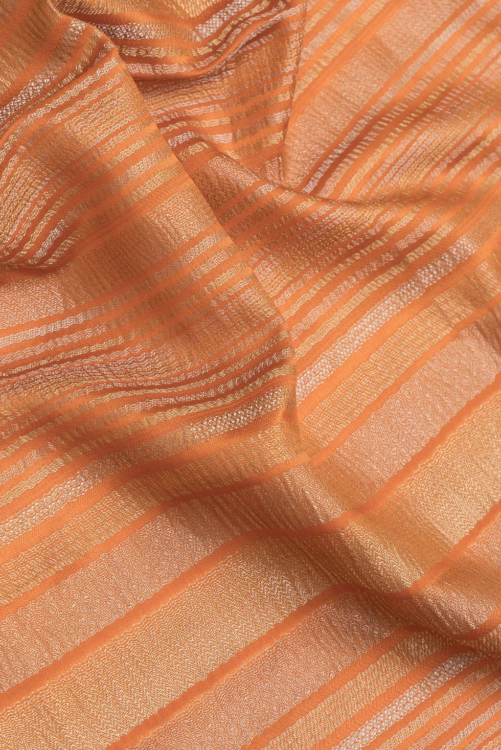 Close up of Orange Dual Tone Mysore Georgette Saree with Stripes on the body and Zari Border.  displaying folds