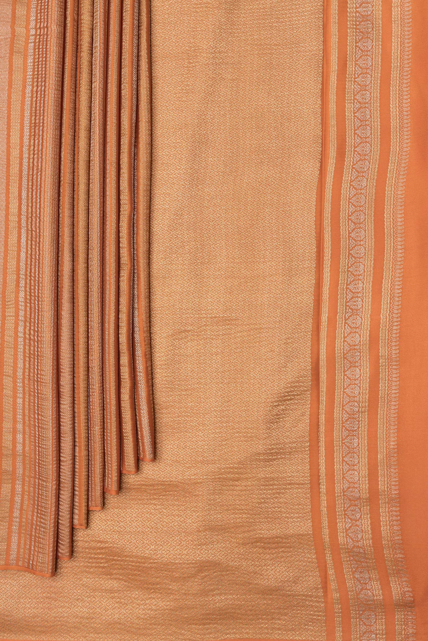 Pleats and pallu of Orange Dual Tone Mysore Georgette Saree with Stripes on the body and Zari Border. 