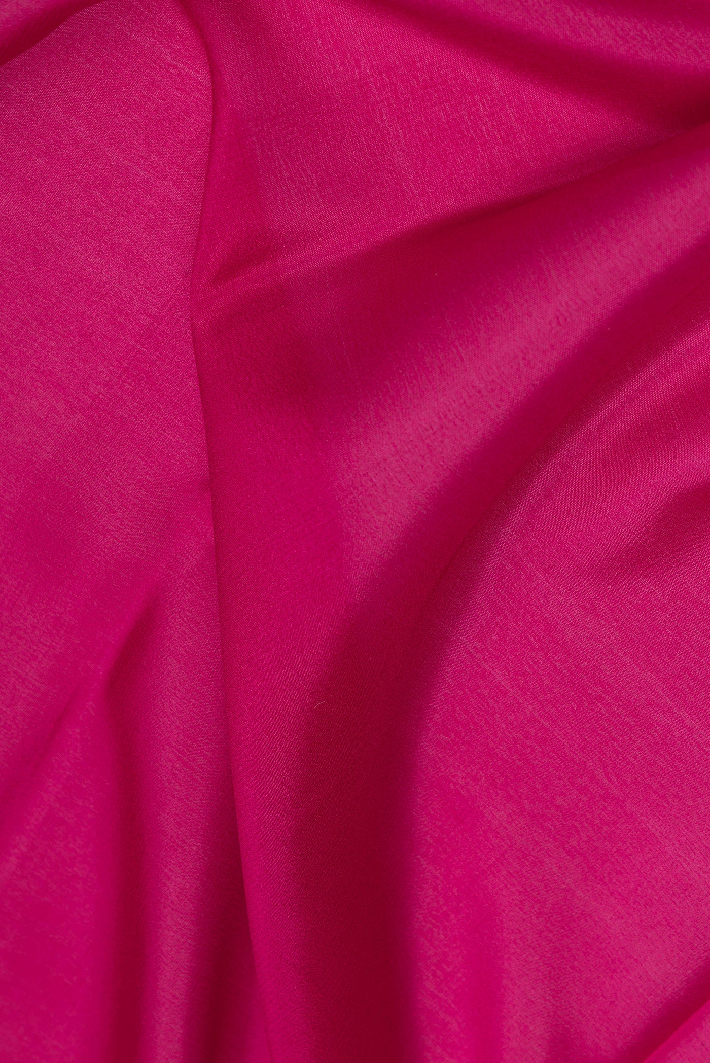 Close up of Magenta Mysore Silk Saree with Plain Body and Zari Border.  displaying folds