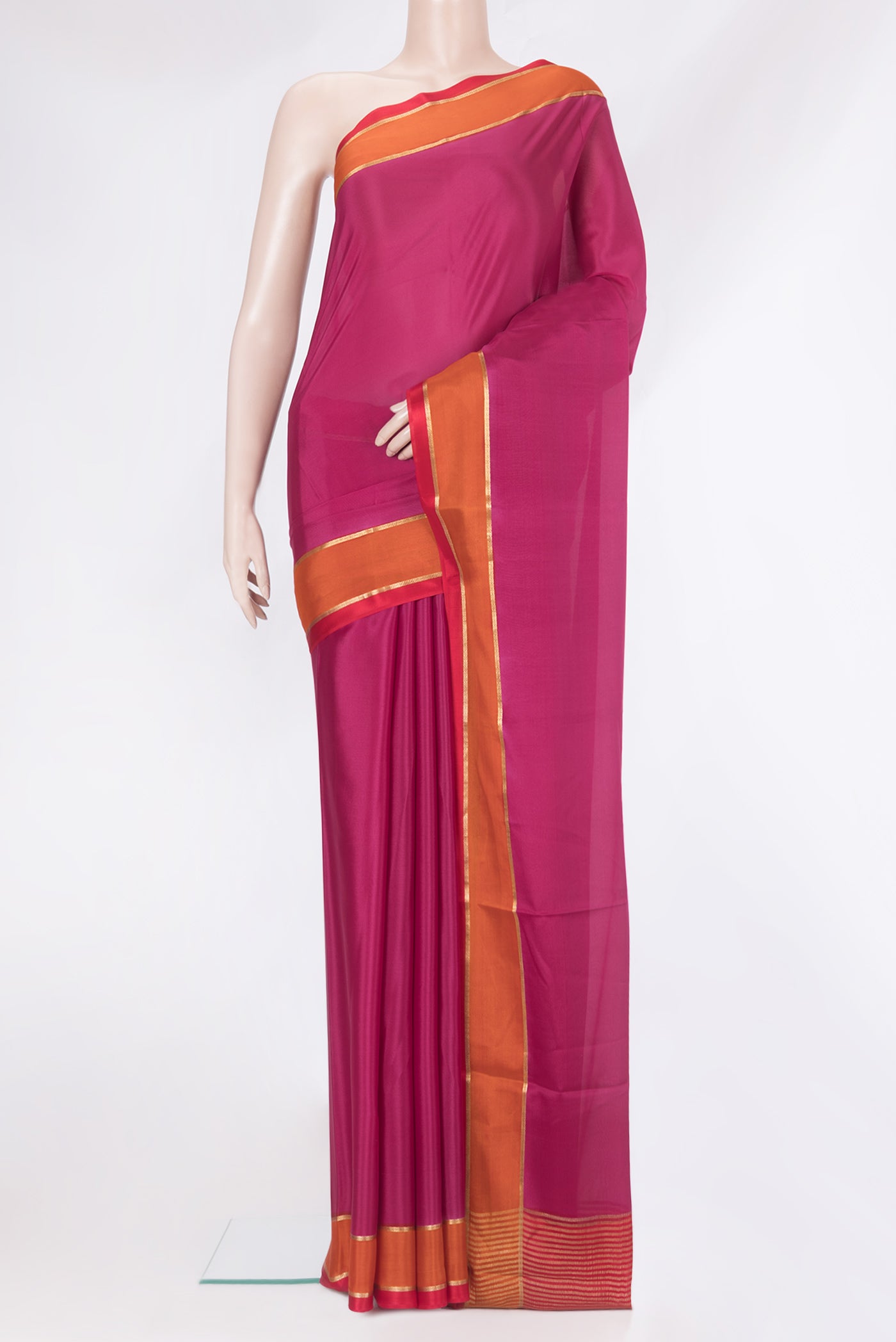 Magenta Mysore Silk Saree with Plain Body and Zari Border.  displayed on a mannequin