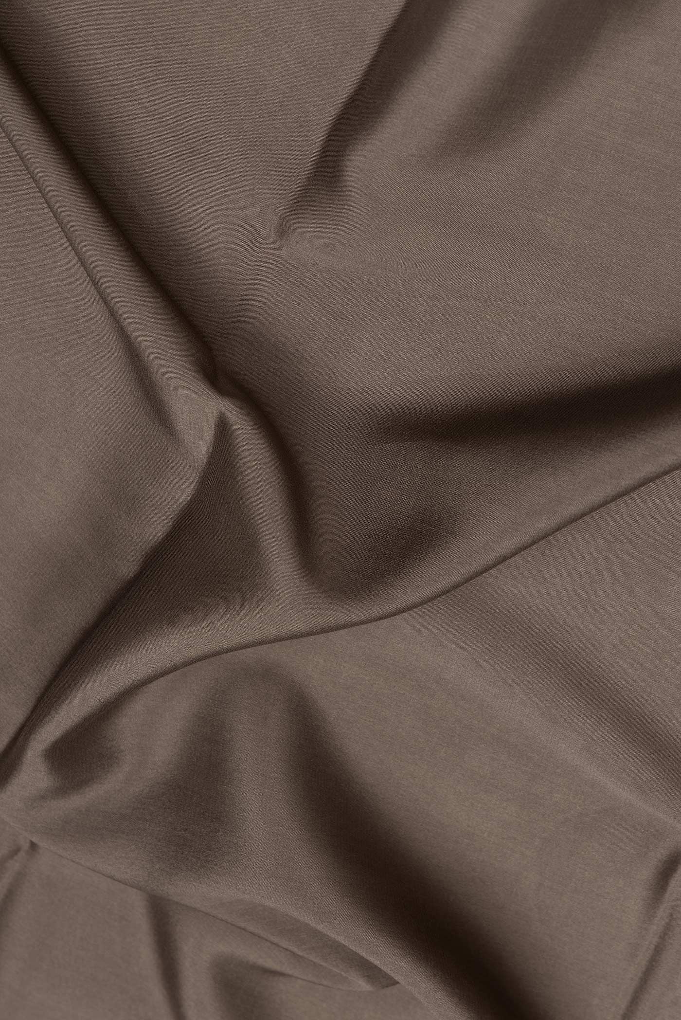 Close up of Mehandi Green Dual Tone Mysore Silk Saree with Plain Body and Zari Border.  displaying folds