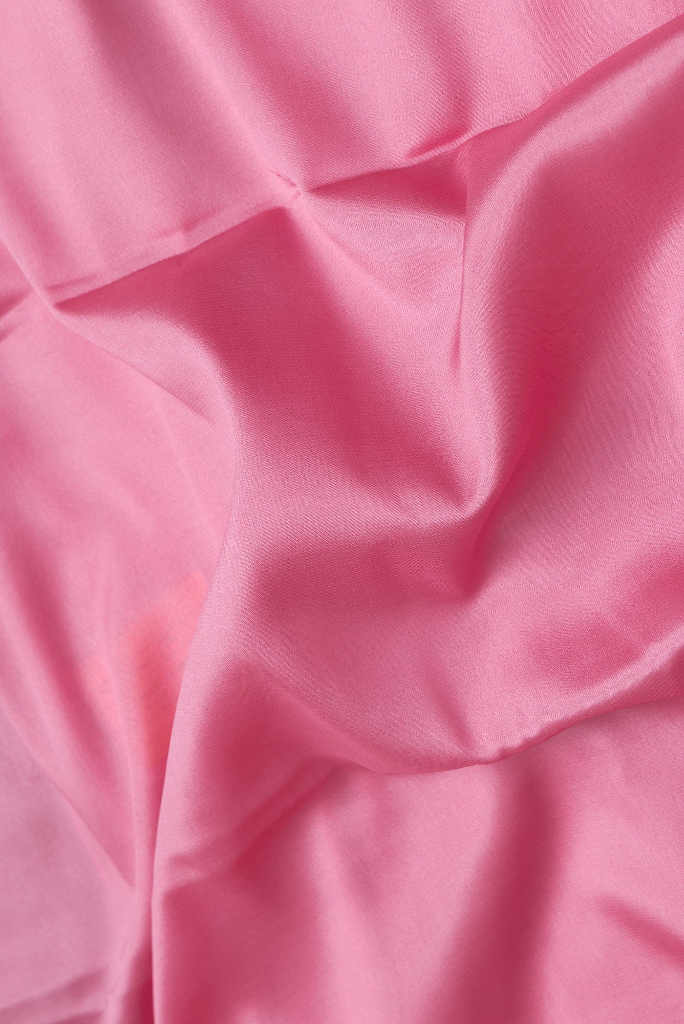 Close up of Pink Dual Tone Mysore Silk Saree with Zari Butta on the body and Zari Border.  displaying folds