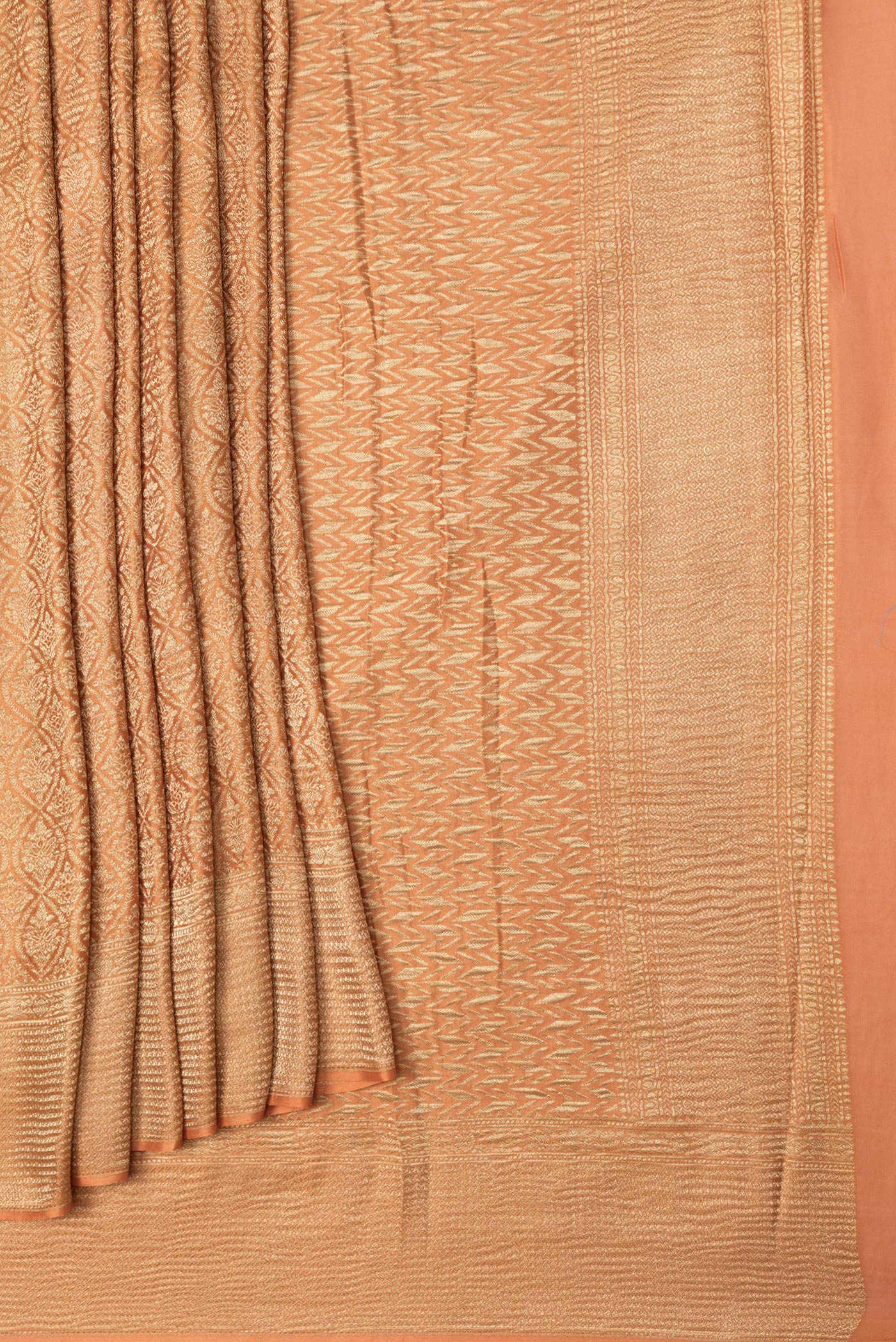 Pleats and pallu of Orange Dual Tone Mysore Georgette Saree with Zari Brocade on the body and Zari Border. 