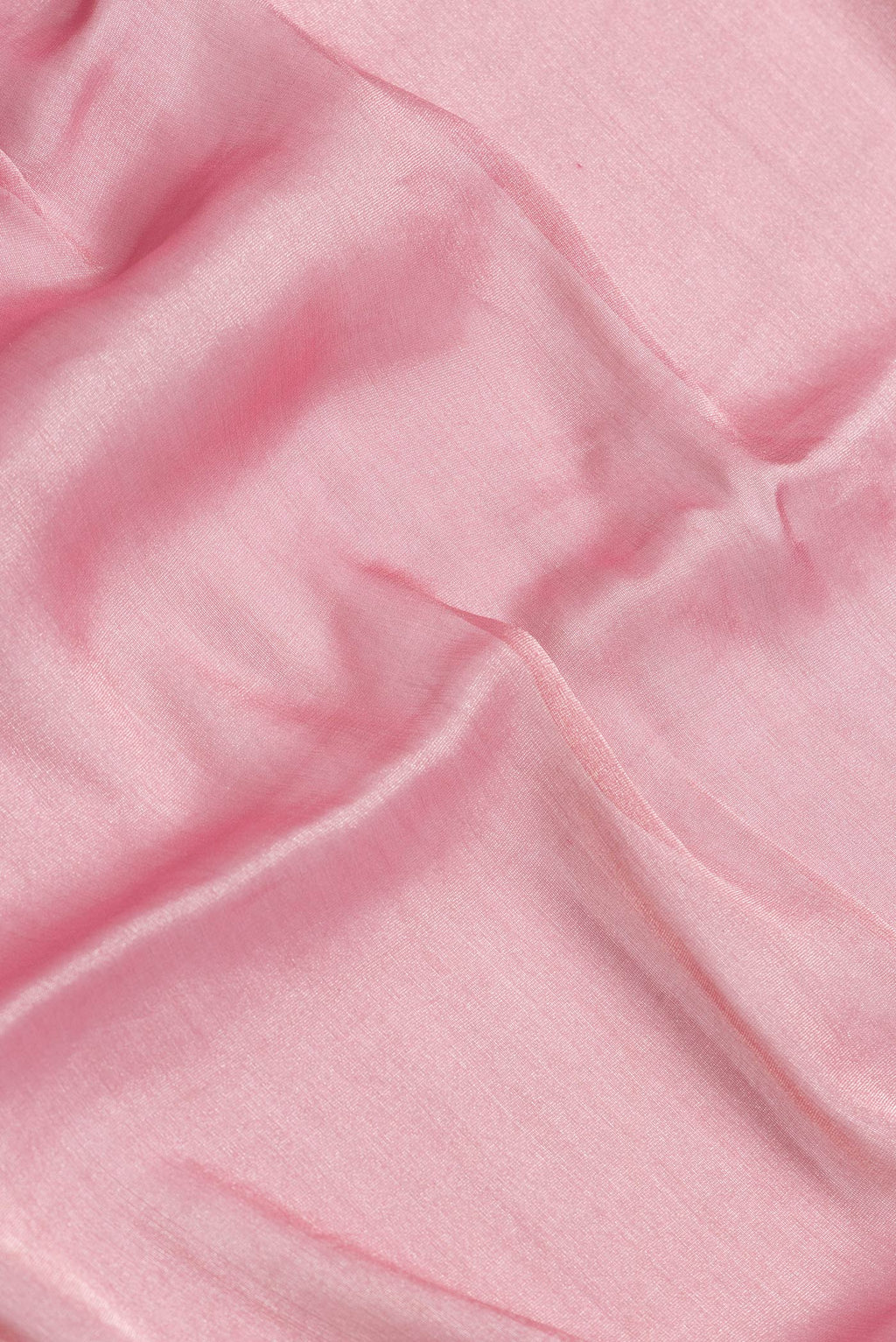 Close up of Pink Dual Tone Georgette Saree with Plain Body and Fancy Border.  displaying folds
