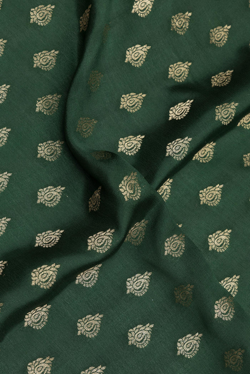 Close up of Bottle Green Dual Tone Banarasi Georgette Saree with Zari Butta on the body and Zari Border.  displaying folds