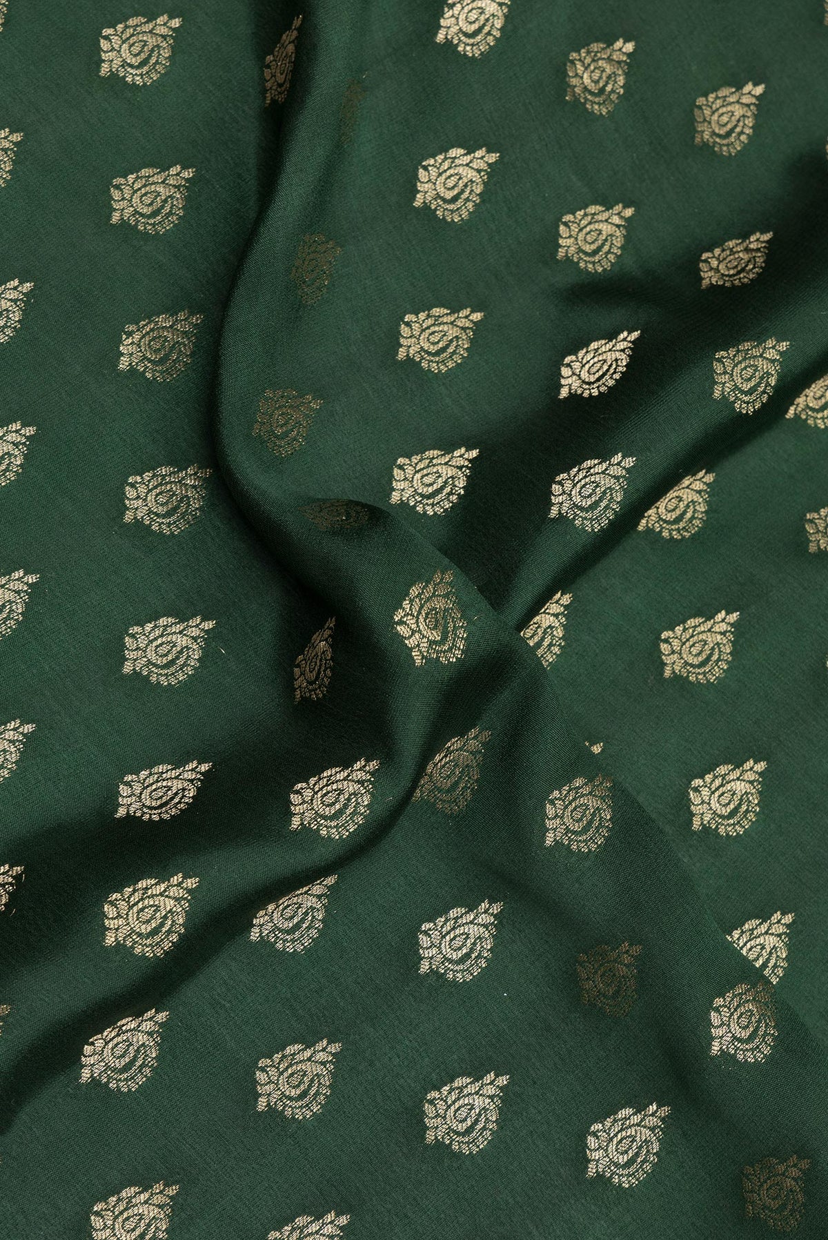 Close up of Bottle Green Dual Tone Banarasi Georgette Saree with Zari Butta on the body and Zari Border.  displaying folds