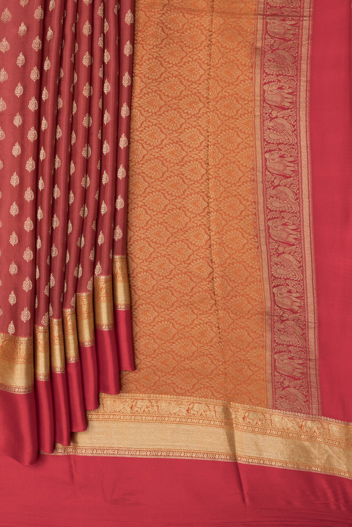 Pleats and pallu of Dark Pink Dual Tone Mysore Crepe Saree with Zari Butta on the body and Zari Border. 