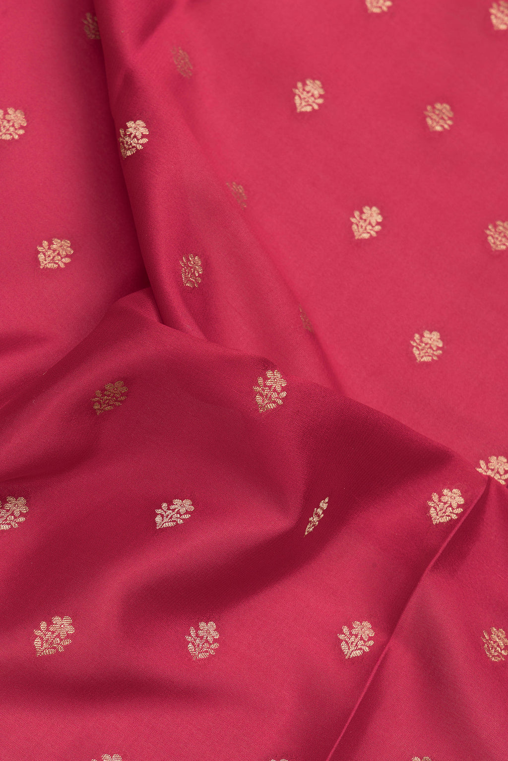 Close up of Red Mysore Crepe Saree with Zari And Thread Butta on the body and Zari Border.  displaying folds