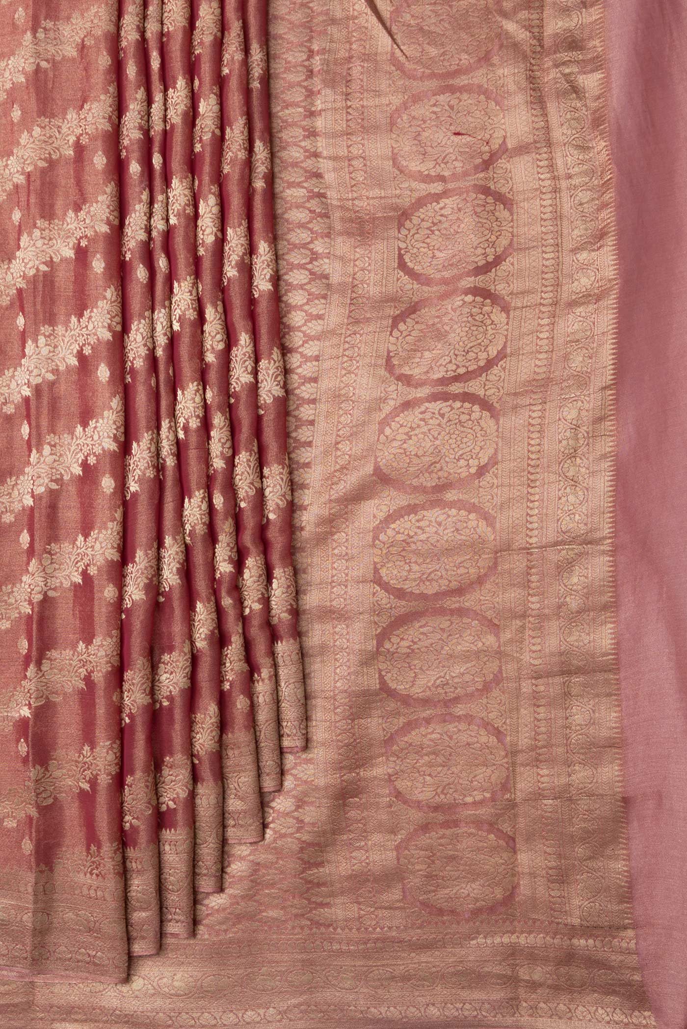 Pleats and pallu of Dark Pink Dual Tone Georgette Saree with Zari Brocade on the body and Zari Border. 