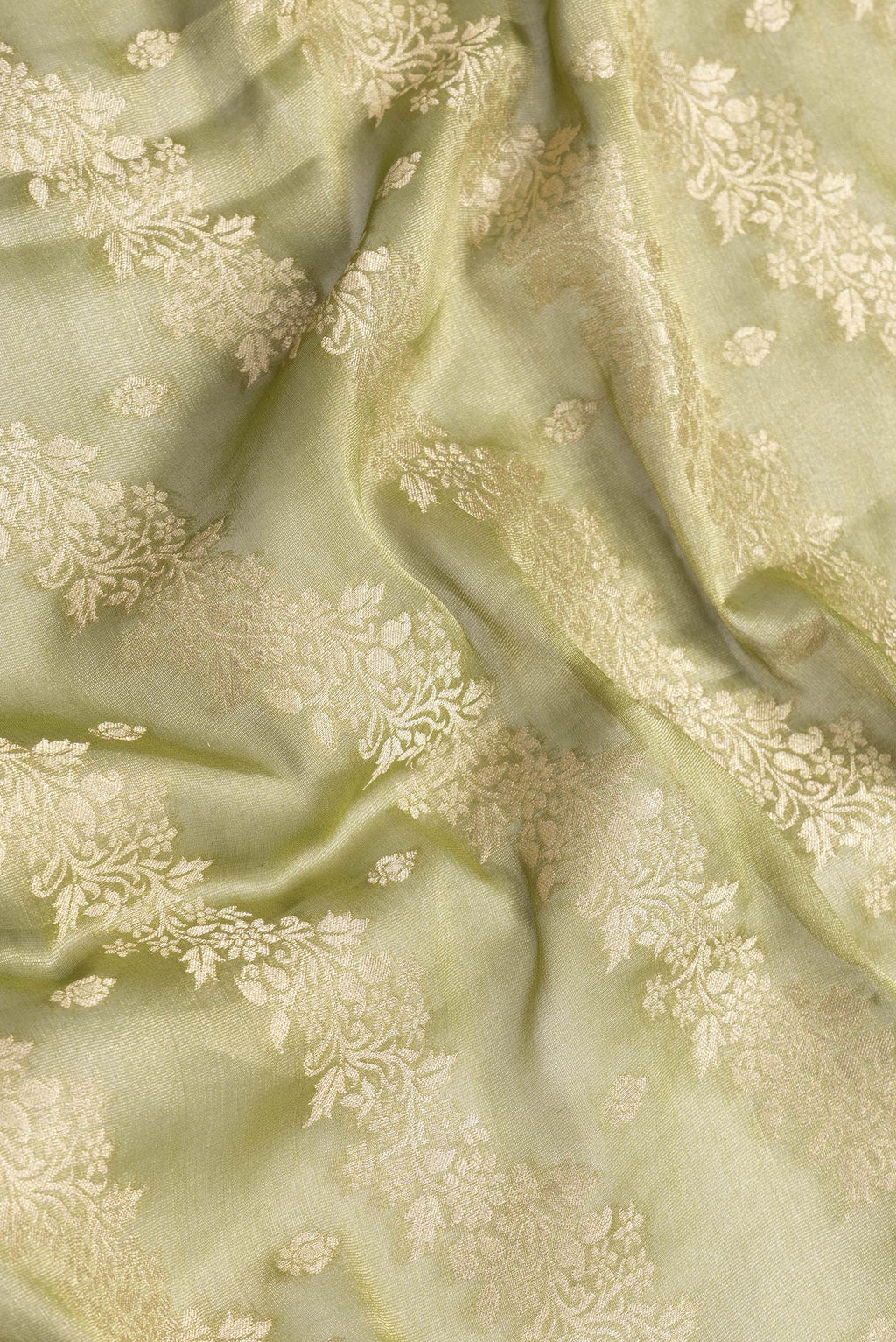 Close up of Mehandi Green Dual Tone Mysore Georgette Saree with Zari Brocade on the body and Zari Border.  displaying folds