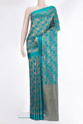 Teal Mysore Crepe Saree with Zari Brocade on the body and Zari And Thread Border.  displayed on a mannequin