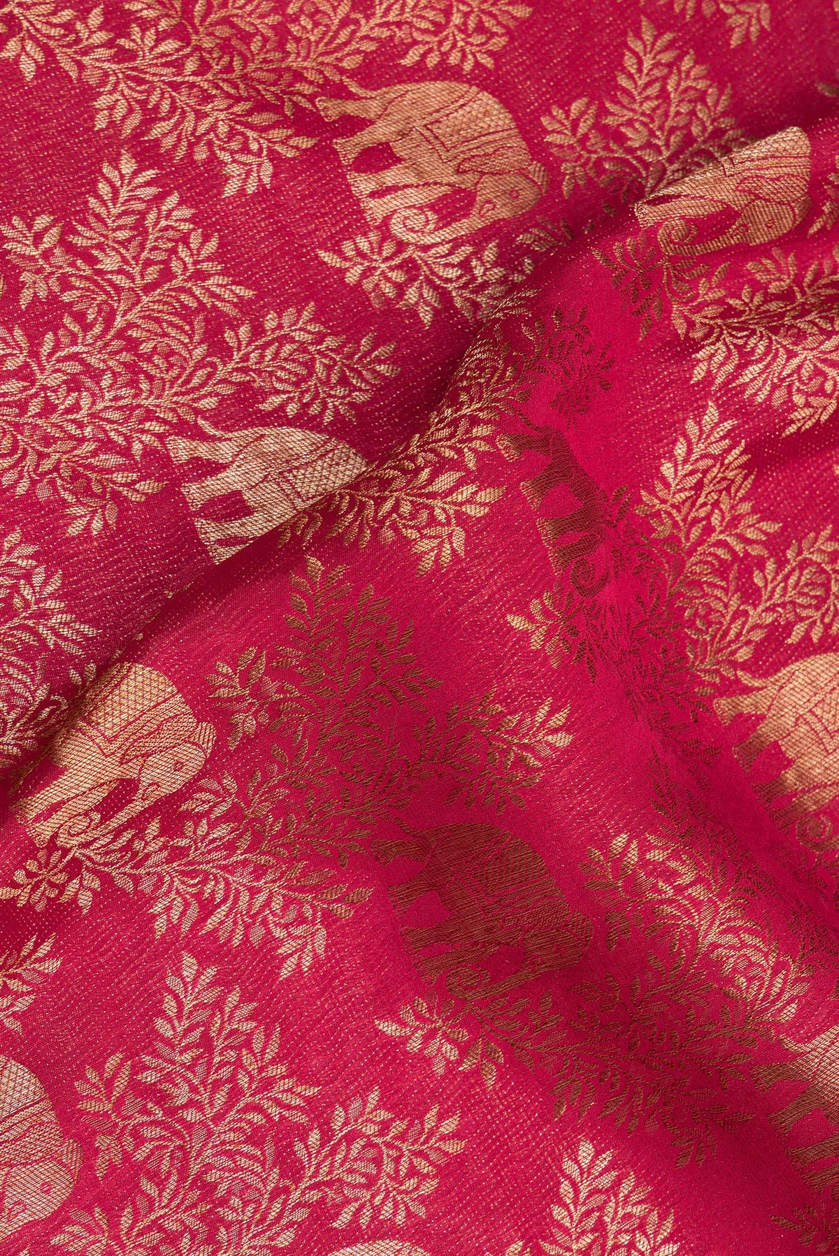 Close up of Dark Pink Dual Tone Banarasi Georgette Saree with Zari Brocade on the body and Zari Border.  displaying folds