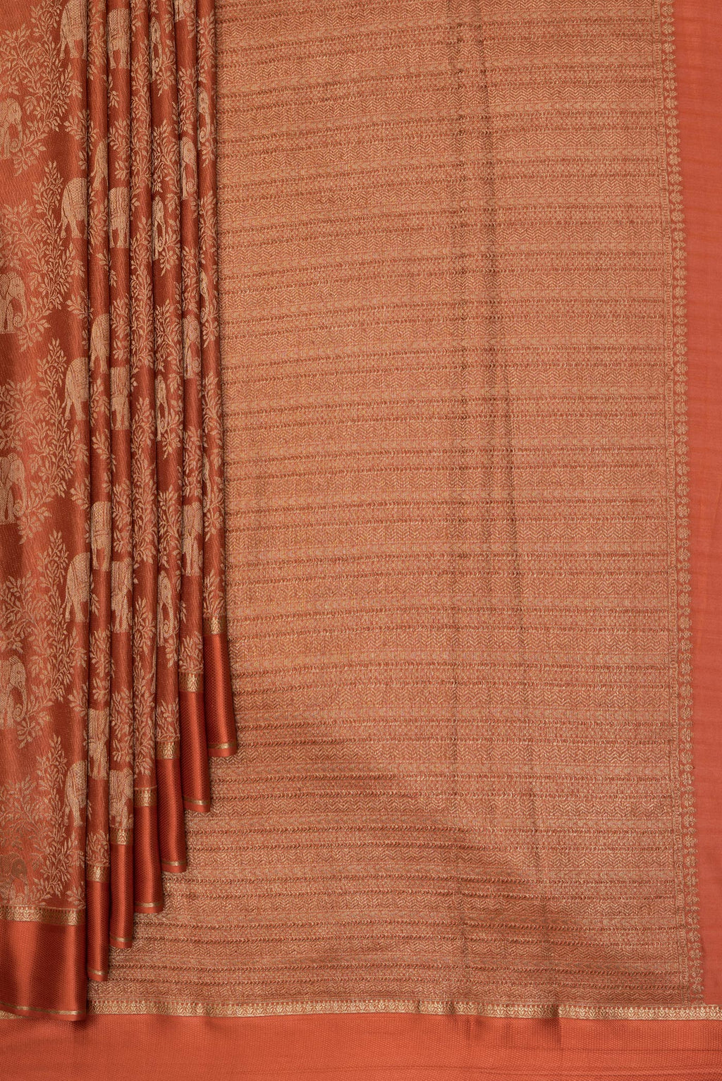 Pleats and pallu of Rust Georgette Saree with Zari Brocade on the body and Zari Border. 