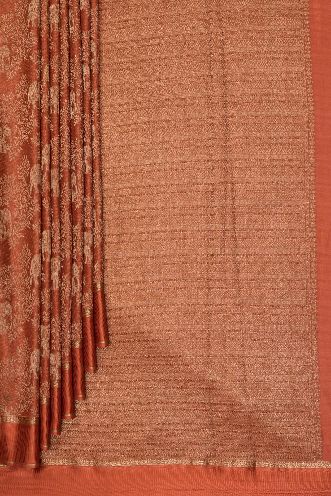 Pleats and pallu of Rust Georgette Saree with Zari Brocade on the body and Zari Border. 
