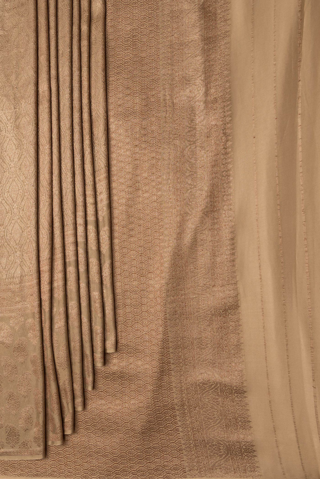 Pleats and pallu of Dark Beige Dual Tone Georgette Saree with Zari Brocade on the body and Fancy Border. 