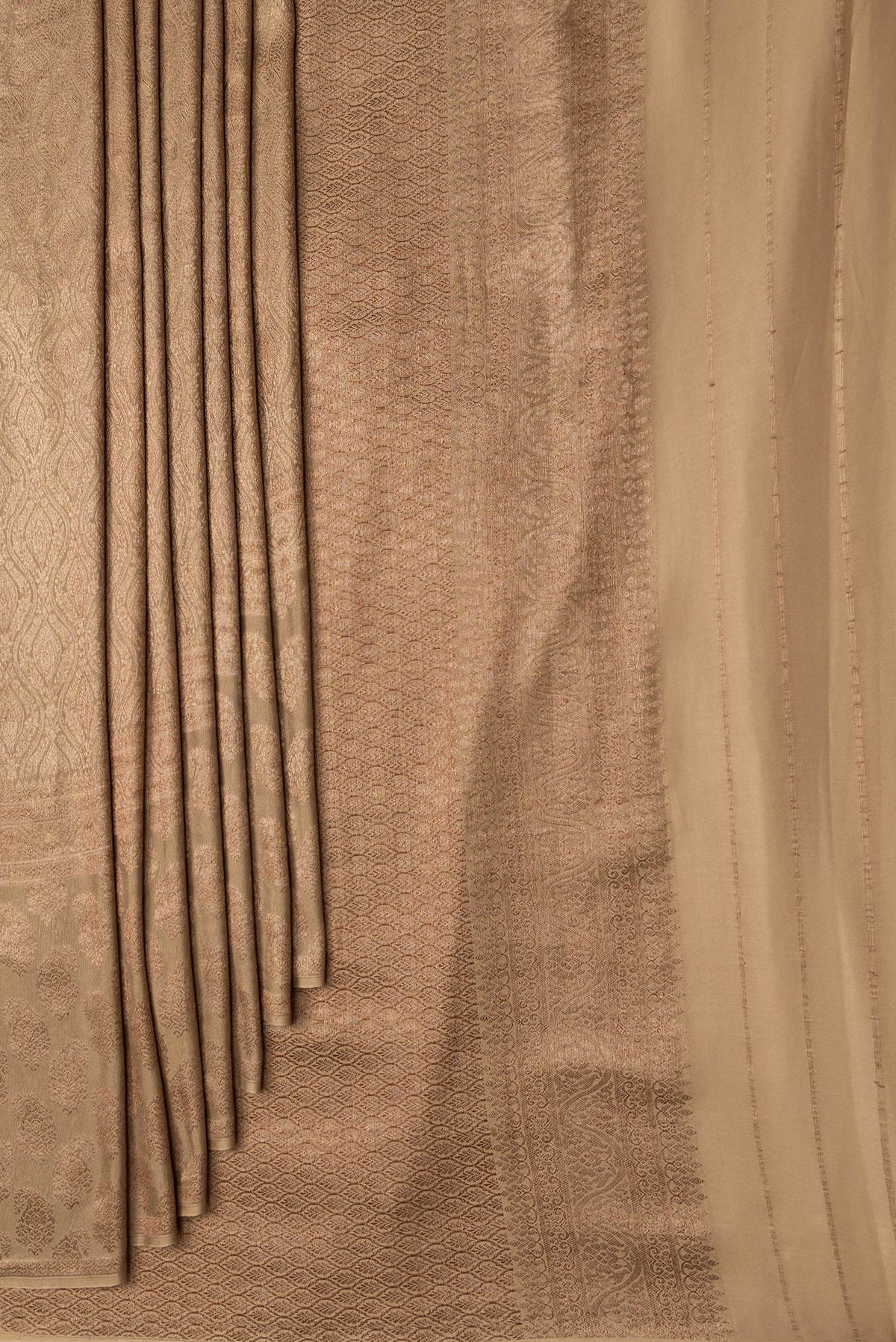 Pleats and pallu of Dark Beige Dual Tone Georgette Saree with Zari Brocade on the body and Fancy Border. 