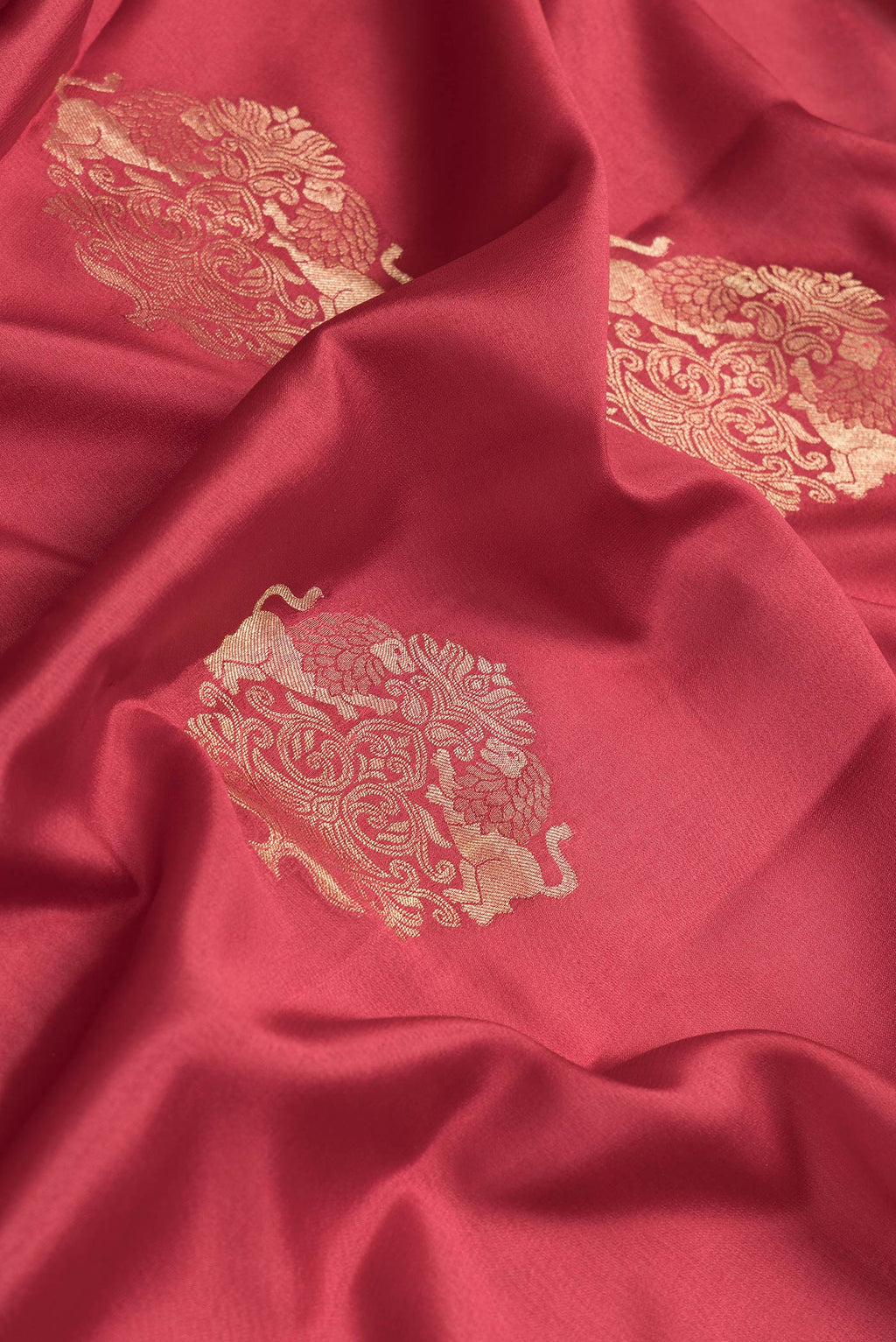 Close up of Maroon Dual Tone Mysore Georgette Saree with Zari Butta on the body and Zari Border.  displaying folds
