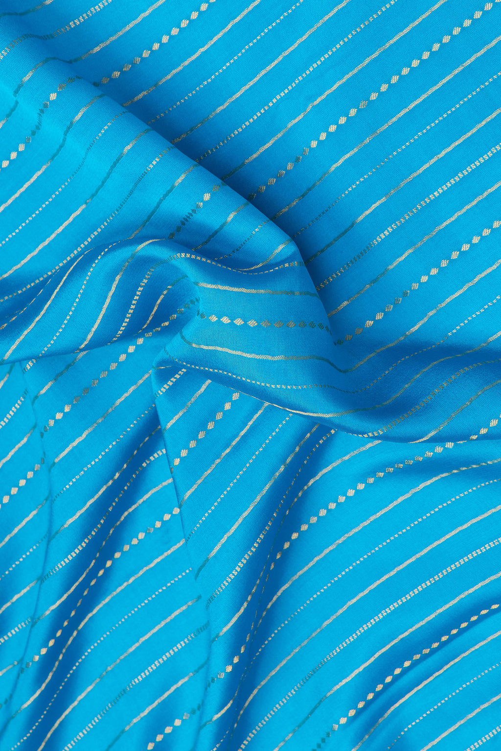 Close up of Sky Blue Dual Tone Mysore Silk Saree with Stripes on the body and Zari Border.  displaying folds