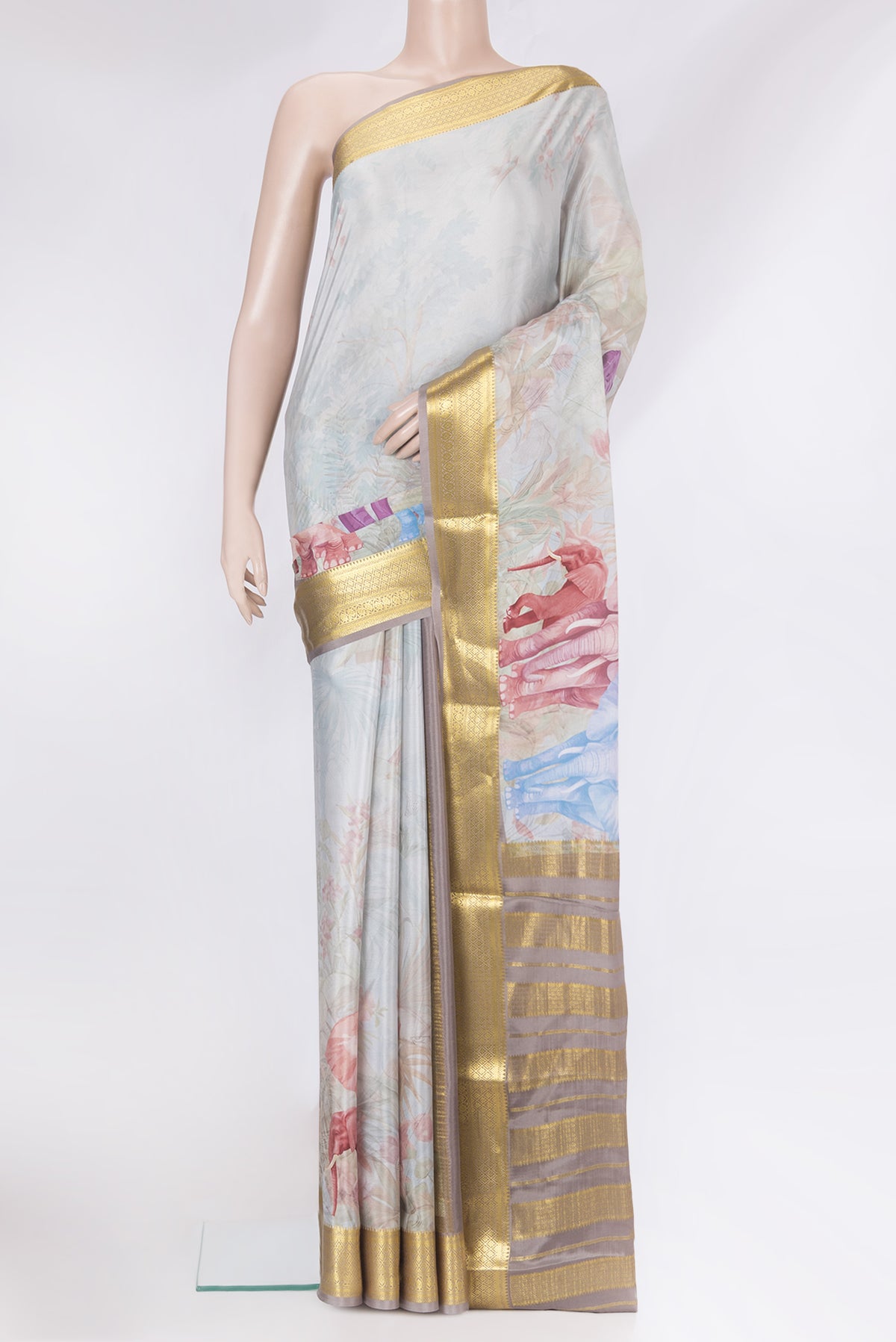 Grey Mysore Silk Saree with Printed design on the body and Zari Border.  displayed on a mannequin