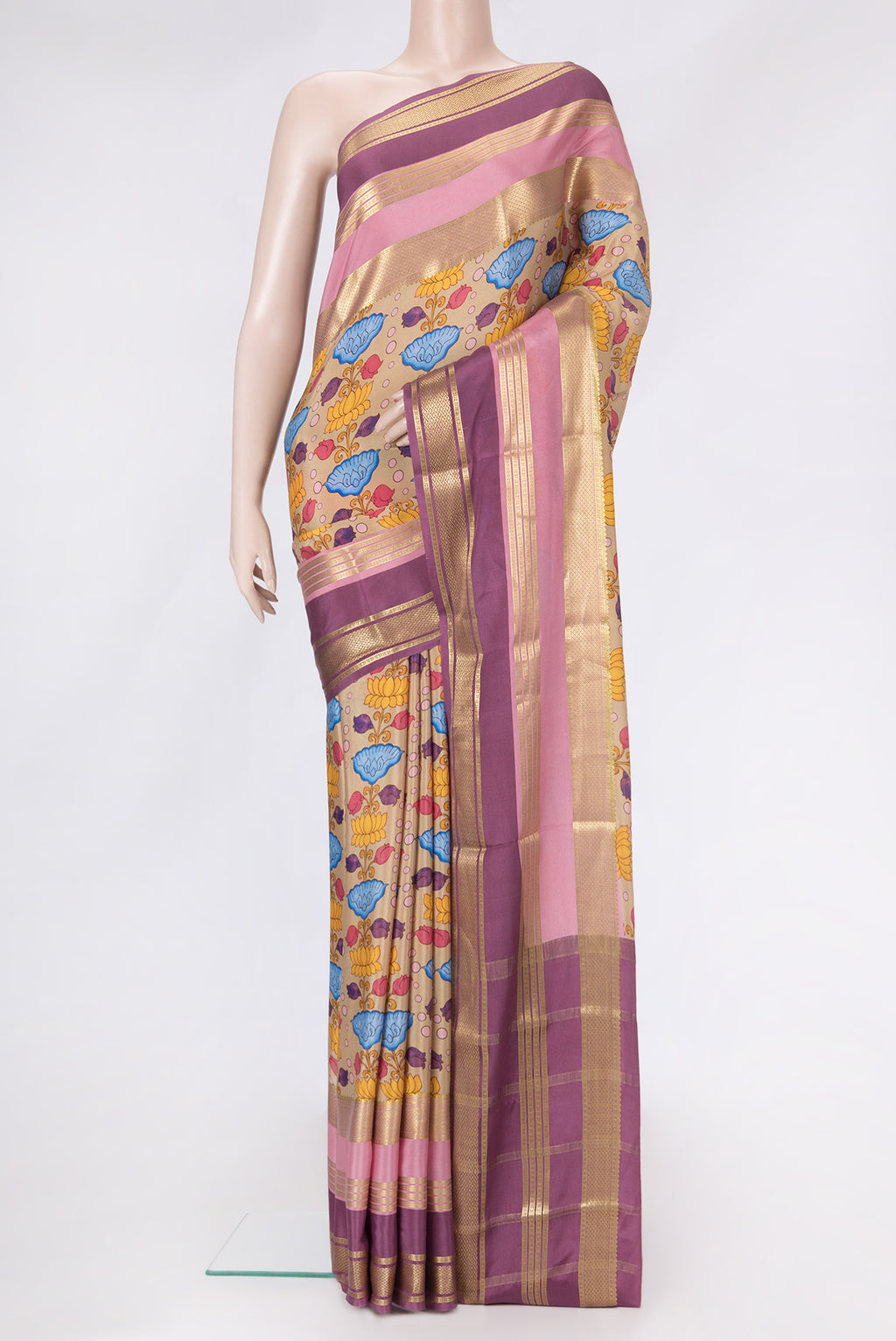 Beige Dual Tone Mysore Silk Saree with Printed design on the body and Zari Border.  displayed on a mannequin