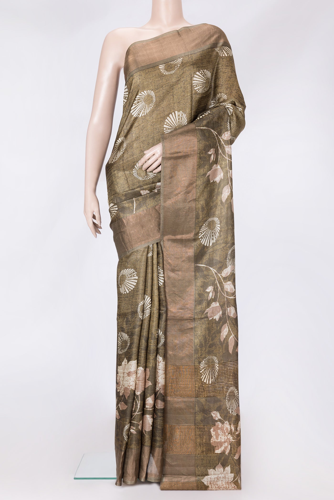 Mehandi Green Dual Tone Tussar Silk Saree with Printed design on the body and Zari Border.  displayed on a mannequin