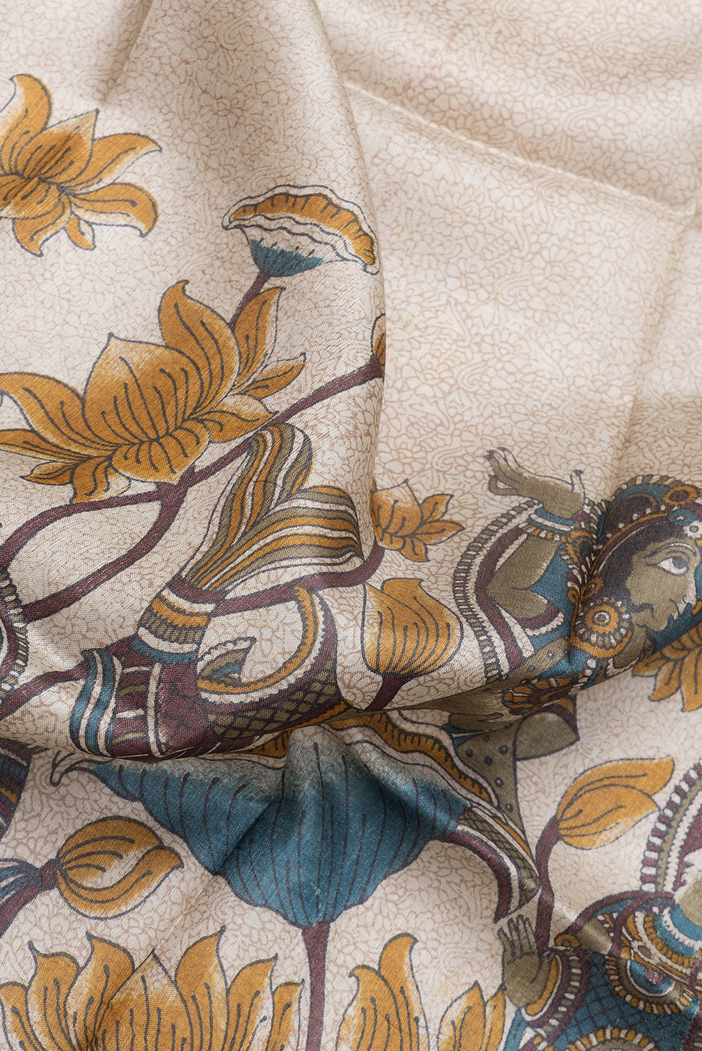 Close up of Beige Dual Tone Tussar Silk Saree with Printed design on the body and Zari Border.  displaying folds