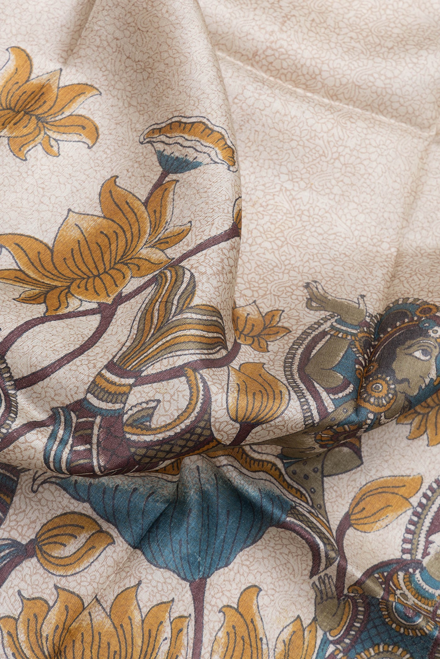 Close up of Beige Dual Tone Tussar Silk Saree with Printed design on the body and Zari Border.  displaying folds