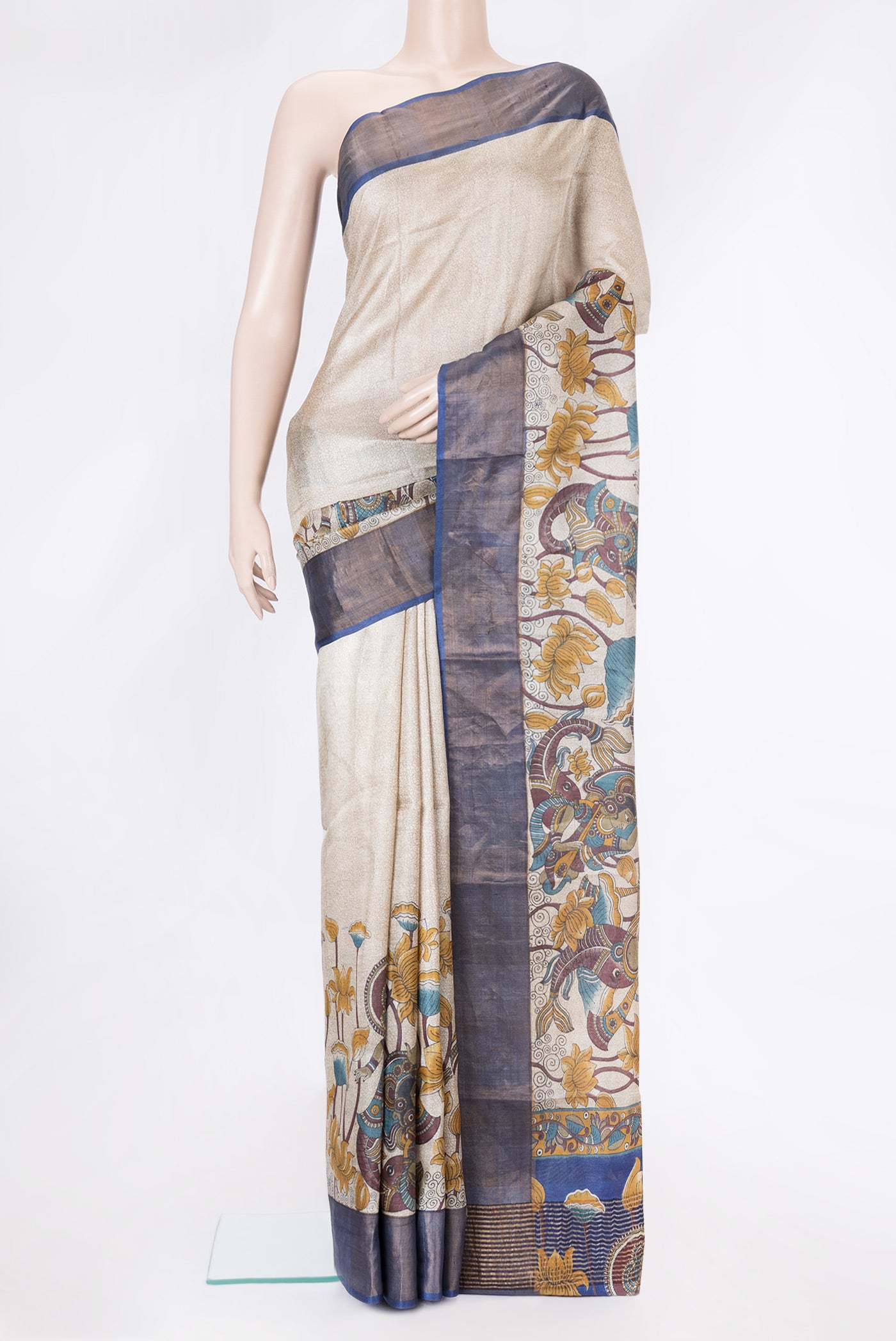 Beige Dual Tone Tussar Silk Saree with Printed design on the body and Zari Border.  displayed on a mannequin